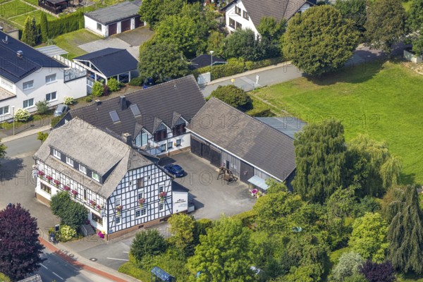 Aerial photo, Hubert Kenter Gasthof Zur Post, half-timbered house with colourful flower boxes,