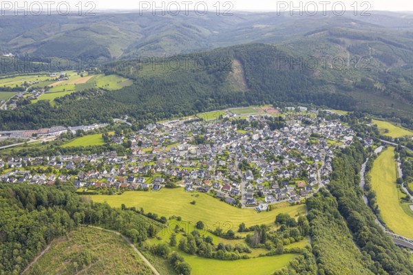 Aerial view, residential area local view Freienohl at the main street with catholic St. Nikolaus