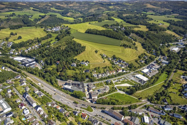 Aerial view, railway station with platform and bus station ZOB, VolmeFreizeitPark, hilly landscape