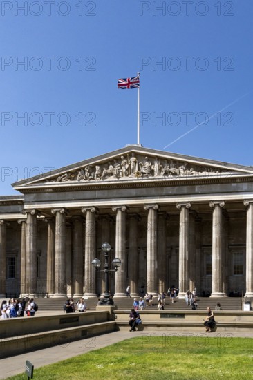 London, United Kingdom - 14 May 2025: Tourists gathering on the steps of the famous British Museum