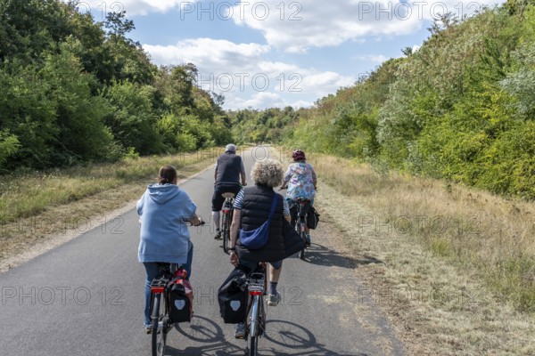 Cyclist on new track at Hambach open-cast mine, Hambach, Rhineland-Palatinate, Germany