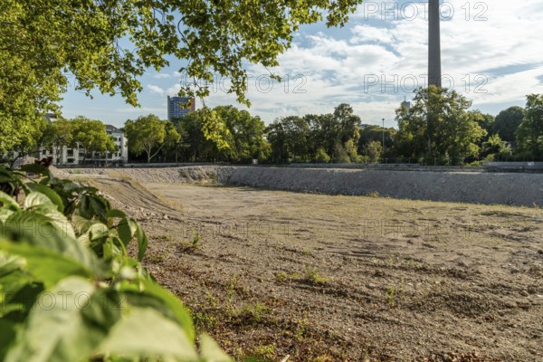 Excavation pit on Innere Kanalstraße with vegetation, Cologne, North Rhine-Westphalia, Germany