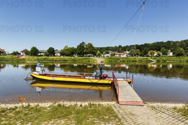 Cyclist on yaw rope ferry, passenger ferry on the Weser, from Herstelle to Würgassen, Beverungen,