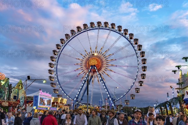 Ferris wheel at Oktoberfest 2024 at dusk, Munich, Bavaria, Germany