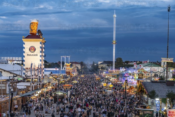 Visitors at the Oktoberfest 2024 seen from above at dusk, Munich, Bavaria, Germany