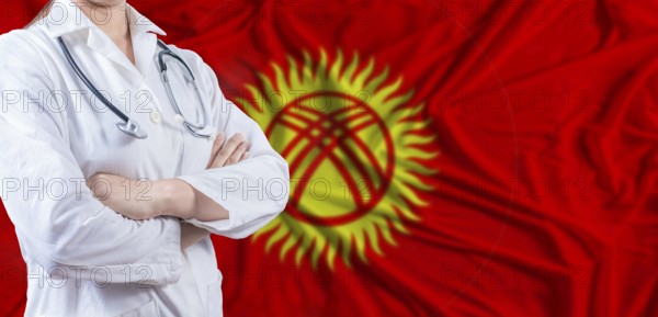 Doctor with crossed arms on Kyrgyzstan flag. Kyrgyzstan health and care concept. Female doctor on