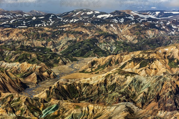 Mountain landscape, snowfields, sunny, summer, volcanic landscape, aerial view, ryolite rock