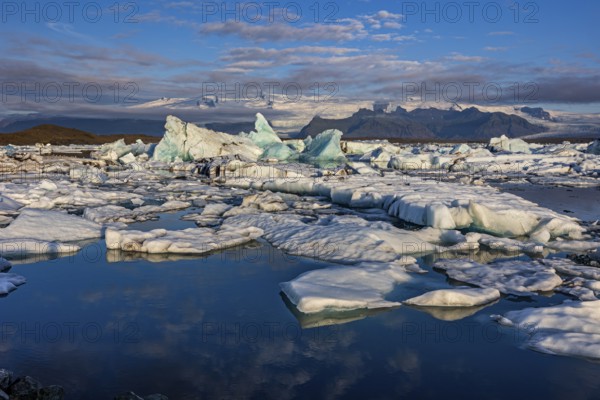 Icebergs, ice floes, lake, glacier lagoon, glacier, mountains, clouds, summer, morning mood,