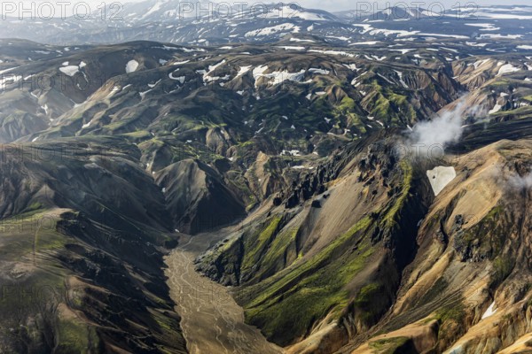 Mountain landscape, sunny, summer, river, snowfields, volcanic landscape, aerial view,