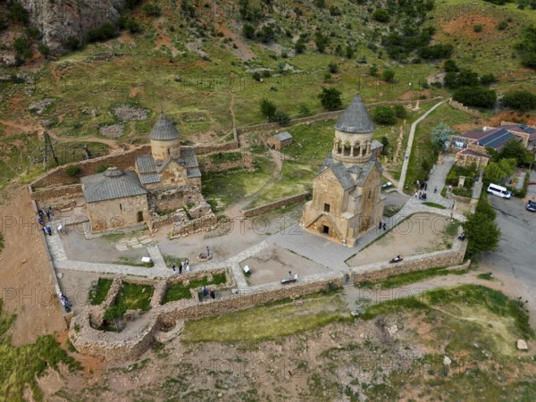 Close-up of an old stone church in a hilly landscape, aerial view, Noravank Monastery, Surb