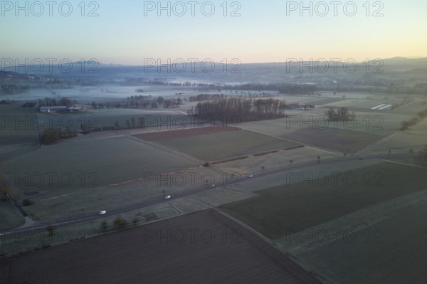 Agricultural fields and meadows in the early morning fog, Reuss Valley, Merenschwand, Freiamt,