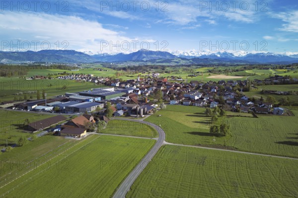 View of the village, in the foreground the industrial area, in the background the Rigi and the