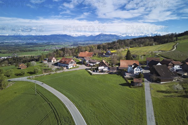 View of the hamlet of Brunnwil, behind the Rigi and the snow-covered Alps, Beinwil, Freiamt,