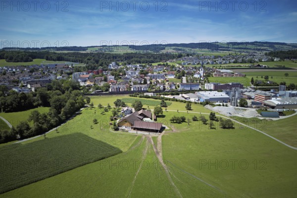 View of the village with the catholic parish church Mariä Geburt, on the right the industrial area,