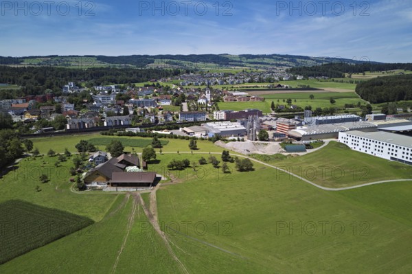 View of the village with the catholic parish church Mariä Geburt, on the right the industrial area,