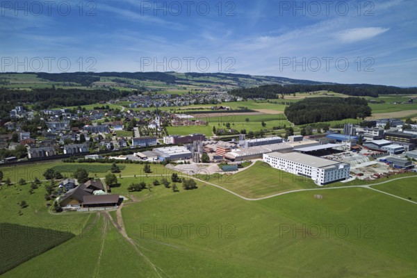 View of the village with the catholic parish church Mariä Geburt, on the right the industrial area,
