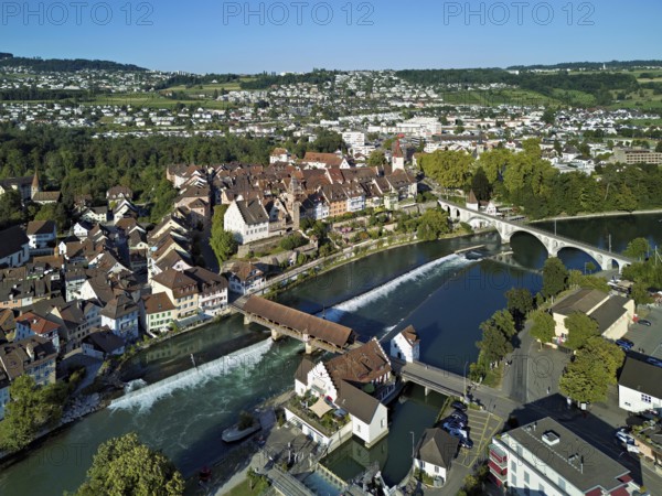 Old town with the tower of the Muri- Amthof, in the foreground the weir, the museum Reusskraftwerk