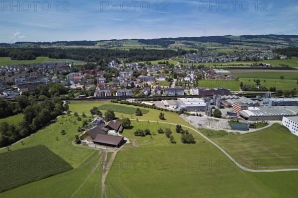 View of the village with the Catholic parish church of the Nativity of the Virgin Mary, industrial