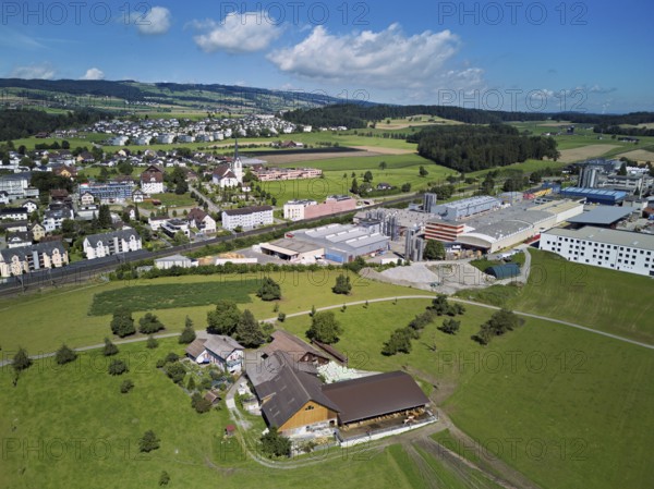 View of the village with the catholic parish church Mariä Geburt, on the right the industrial area,