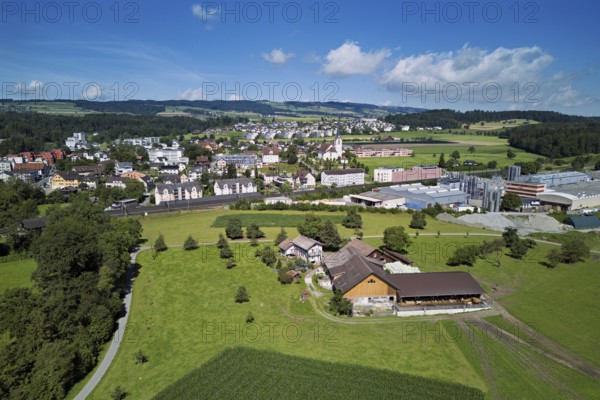 View of the village with the catholic parish church Mariä Geburt, on the right the industrial area,