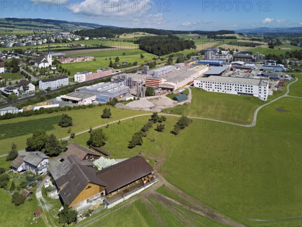 View of the village with the catholic parish church Mariä Geburt, on the right the industrial area,
