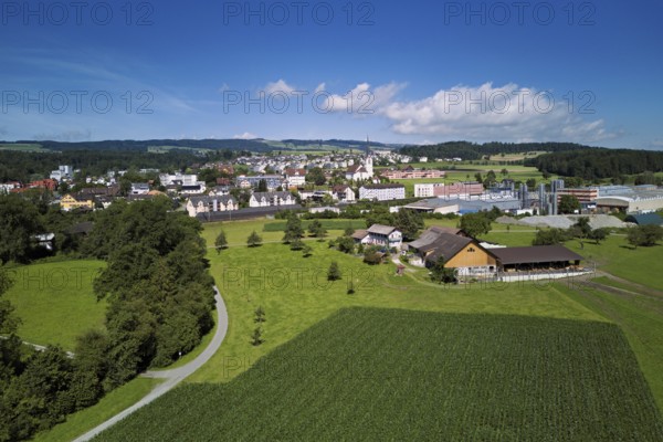 View of the village with the catholic parish church Mariä Geburt, on the right the industrial area,