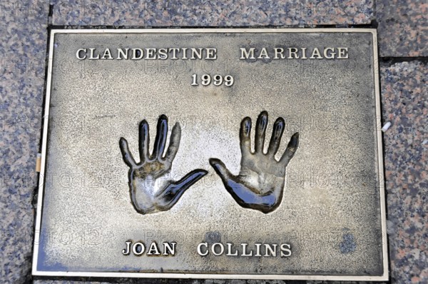 Metal plate with handprints and the inscription of Joan Collins, Clandestine Marriage 1999, London,