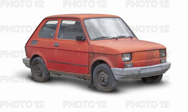Small rundown red compact car in white back with shadow