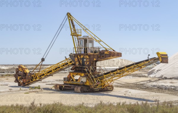 Bucket-wheel excavator near a salt production facility around Salin-de-Giraud located in in the