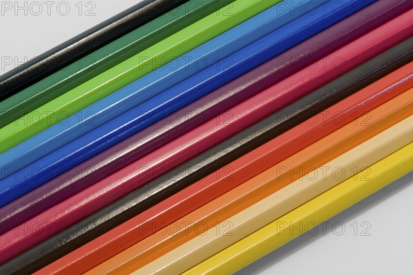 Detail shot of some colored pencils in light back