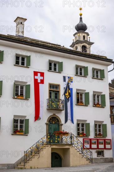 Beautiful City Hall with Swiss and Canton Flag in a Summer Day in Samedan, Grisons, Switzerland