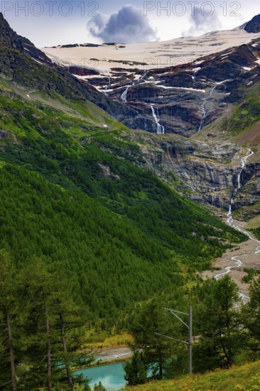 Beautiful Mountain Alp Grüm with Glacier and Alpine Lake Palü in the Swiss Alps in a Sunny Cloudy