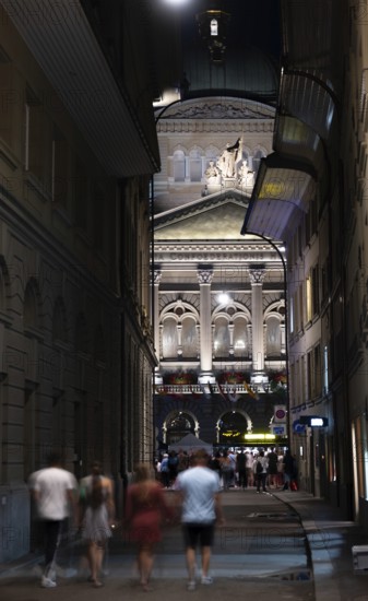 Beautiful Bundeshaus Illuminated Parliament Building or Federal Palace and a Street with People at
