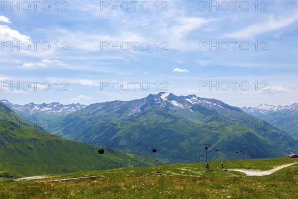 Beautiful Panoramic View over Mountain Peak with Snow in the Swiss Alps From Overhead Cable Car in