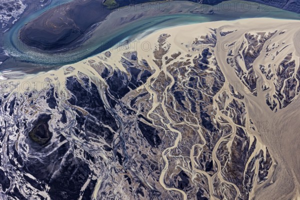 Mountain landscape, river, river delta, river course, volcanic landscape, sunny, aerial view,