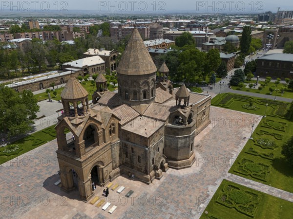 Close-up of a historic church with detailed architecture in urban surroundings, aerial view,