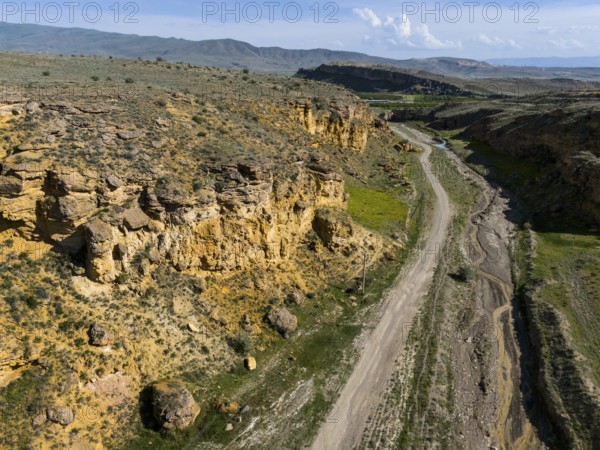 Geological formations along a dirt road in a barren landscape, aerial view, landscape at Angel's