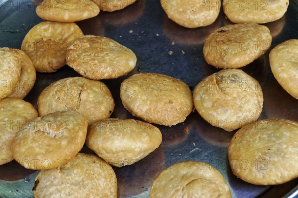 Udaipur, Rajasthan, North India, Asia, Kachori, a golden-brown and crispy snack, lies ready on a
