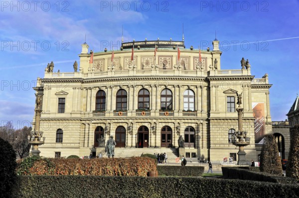 Exterior view of the Rudolfinum with people in front of it, historic building with elaborate