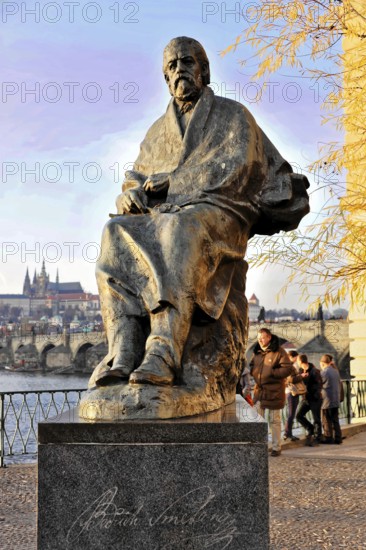 Smetana Monument, Prague, Czech Republic, Europe, Statue of a man on a promenade with people in the