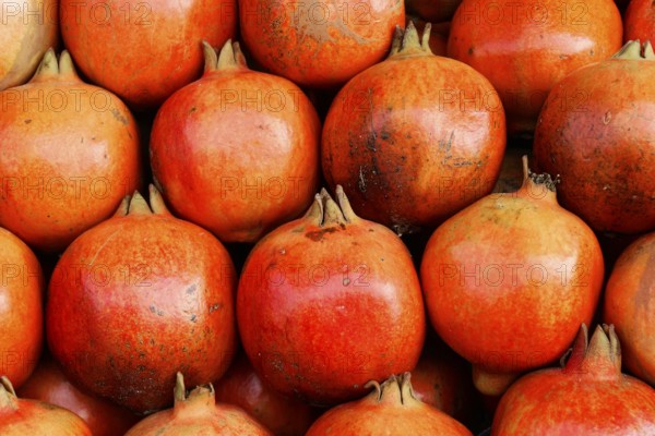 Kota, Rajasthan, North India, Asia, Ripe, red pomegranates close together, with a smooth surface