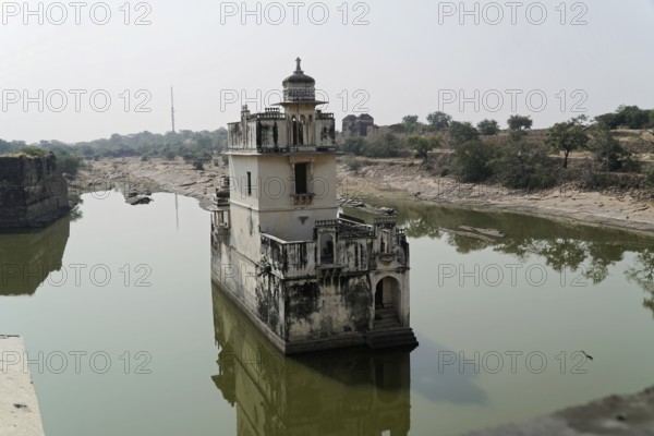 Kota, Rajasthan, North India, Asia, Historic tower in the middle of a lake with reflecting water