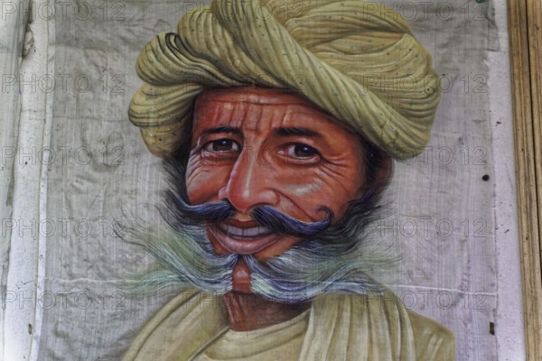 Painting, Sale, Souvenir, Udaipur, Rajasthan, India, Asia, Portrait painting of a man with smiling