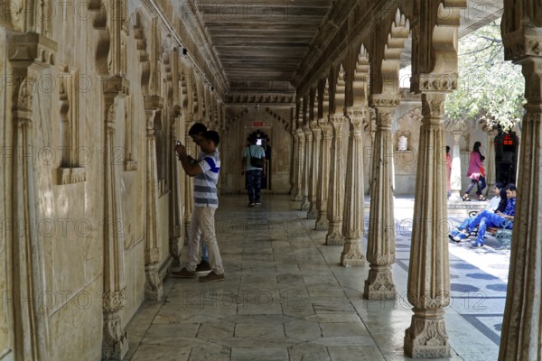City Palace, Udaipur, Rajasthan, India, Asia, A long corridor decorated with stone carvings and