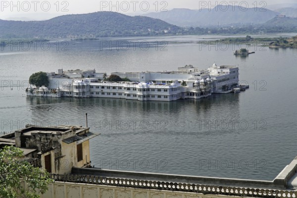 Lake Pichola overlooking Lake Palace, Udaipur, Rajasthan, India, Asia, Palace on a lake surrounded