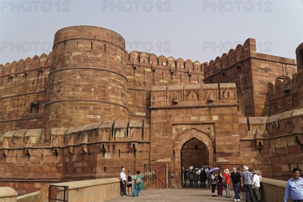 Red Fort, Agra, Uttar Pradesh, India, Historic fortress gate with visitors and battlements,