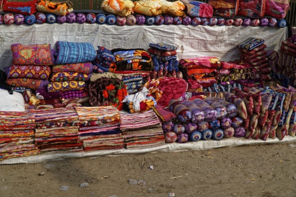 Colourful handmade cushions and textiles on a market stall, Agra, Jodhpur, Rajasthan, North India