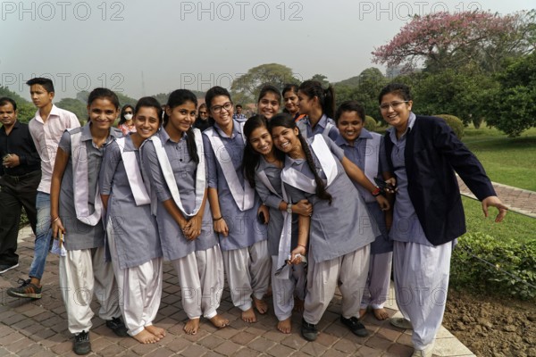 A group of students in uniforms posing happily in a park, Agra, Jodhpur, Rajasthan, North India