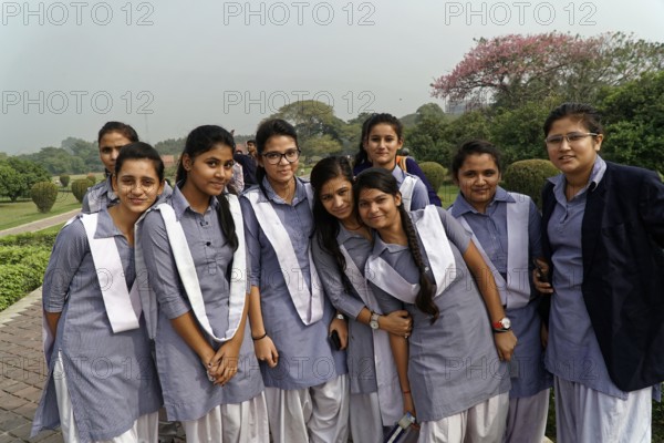 Agra, Jodhpur, Rajasthan, North India, Asia, A group of cheerful girls in uniforms poses smiling in