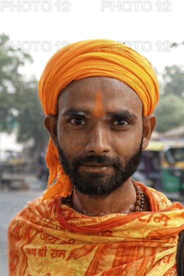 Agra, Jodhpur, Rajasthan, North India, AsiaPortrait of a man with orange turban and traditional